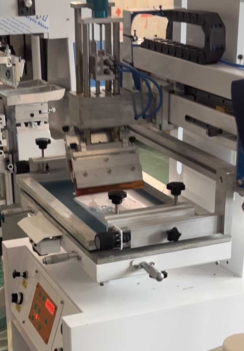 Screen printing machine in working operation