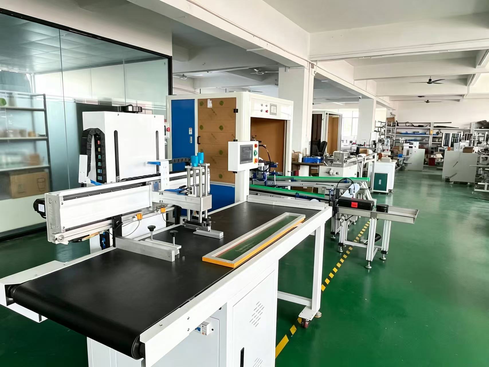 Interior view of printing machinery manufacturing workshop with production equipment