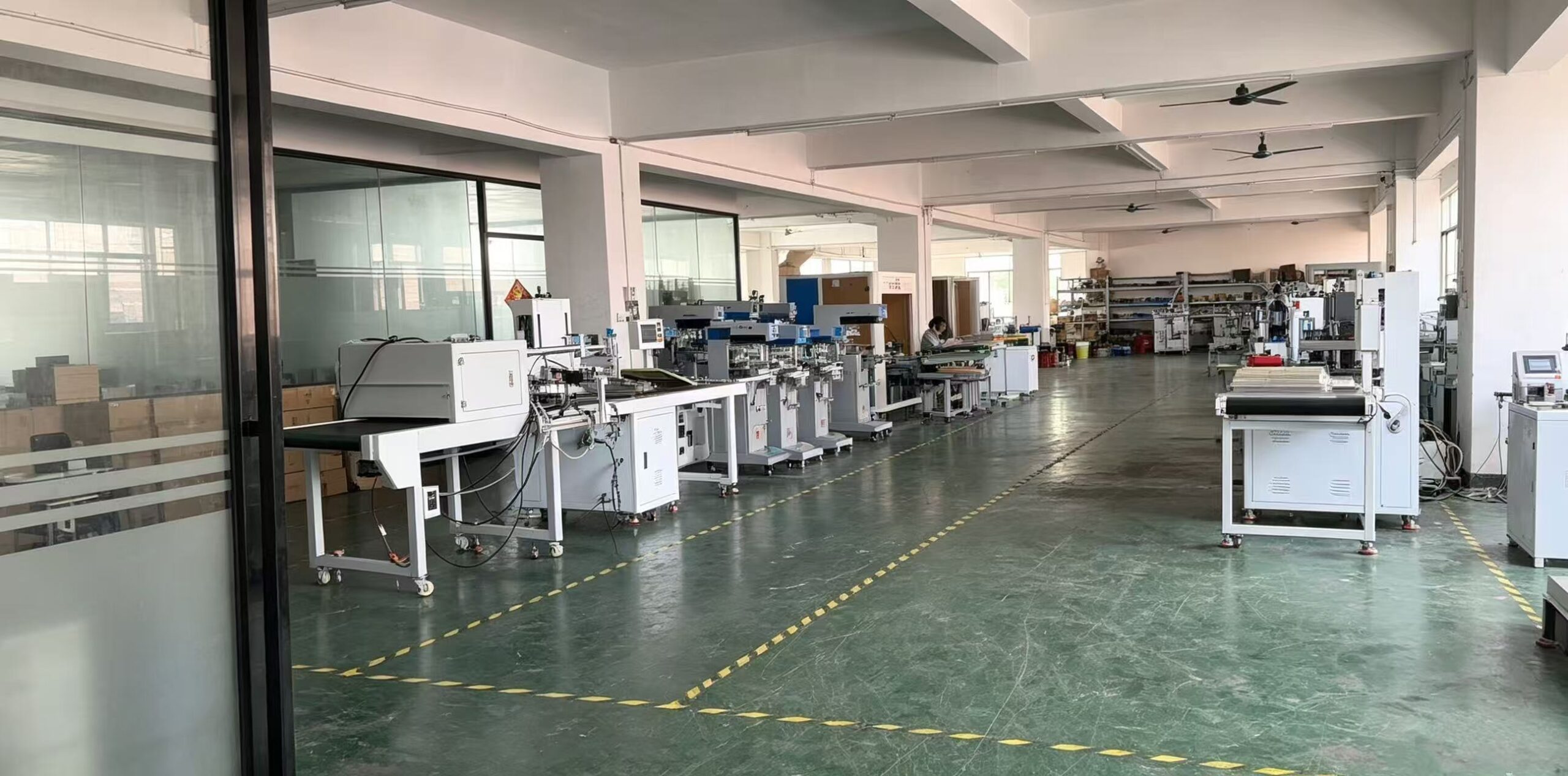 Factory workshop with printing and UV‑LED curing machines
